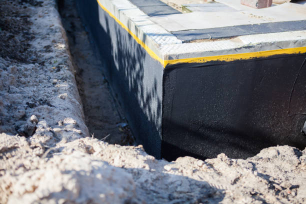 Professional Waterproofing technician working in Forest Junction, WI